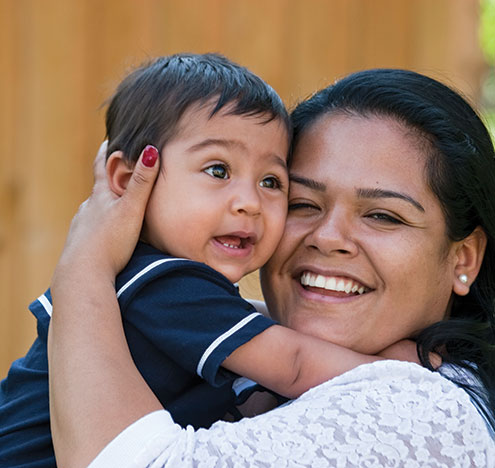 A woman holding her baby. Links to Gifts by Estate Note
