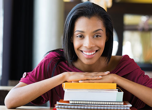 Photo of a woman smiling. Link to Life Stage Gift Planner Under Age 45 Situations.