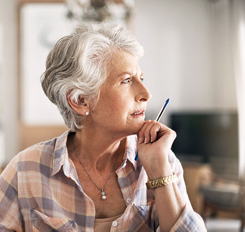 A woman looking at a window. Links to Gifts by Will